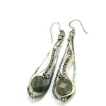 Oxidized sterling silver long drop earrings with labradorite and pyrite gemstones held within brass and sterling silver wire