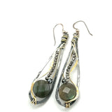 Oxidized sterling silver long drop earrings with labradorite and pyrite gemstones held within brass and sterling silver wire