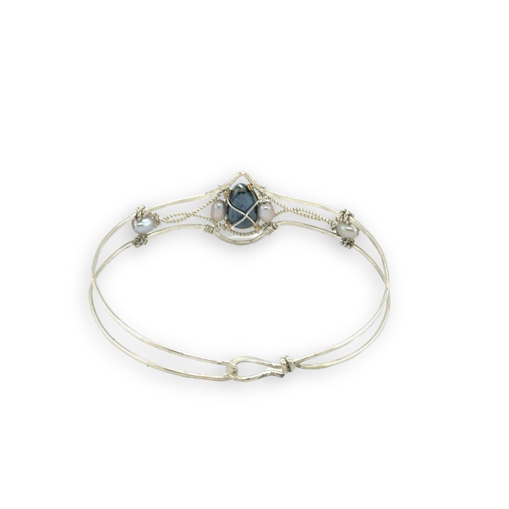 Delicate bracelet with a central labradorite flashy stone and silver fresh water pearl accents