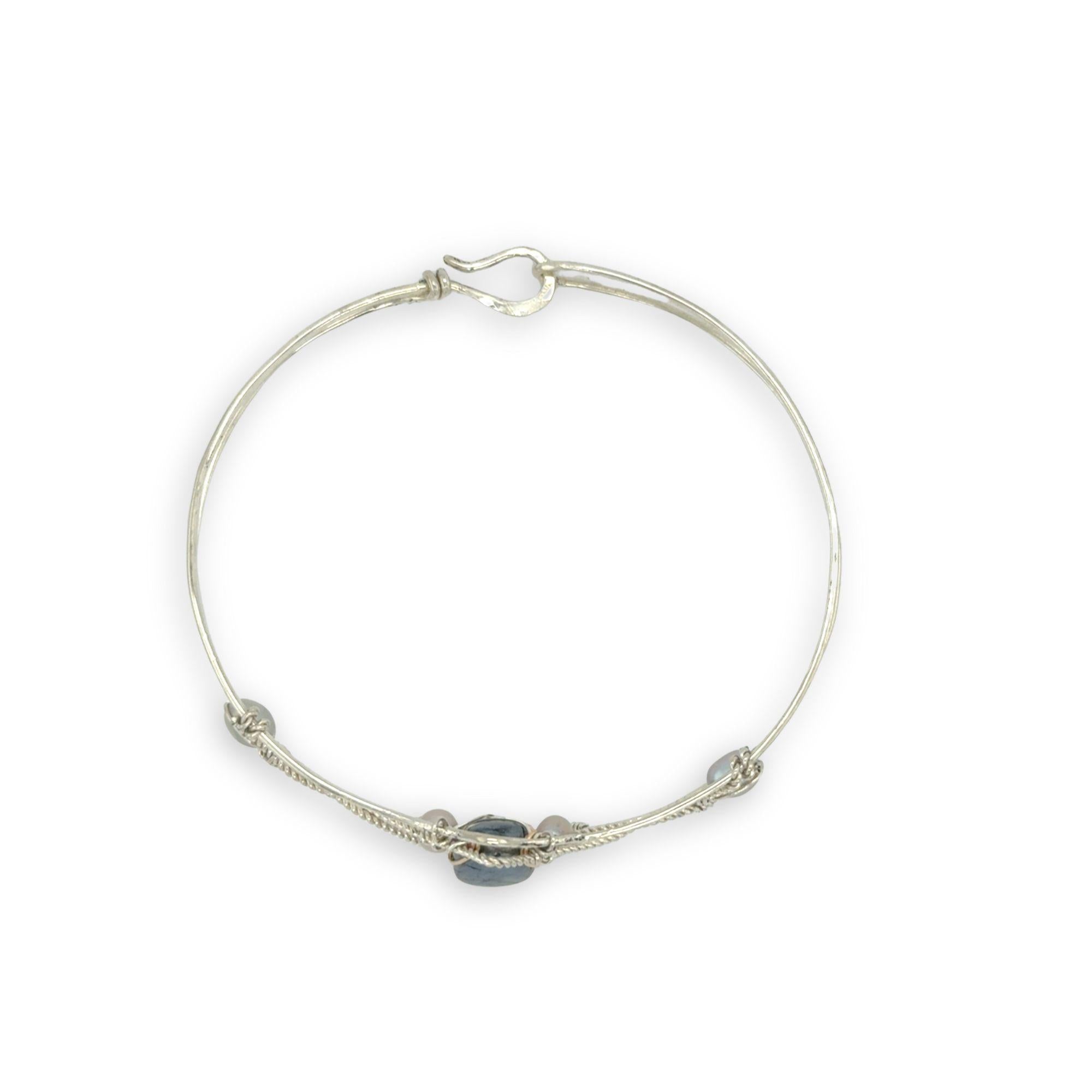 Delicate bracelet with a central labradorite flashy stone and silver fresh water pearl accents