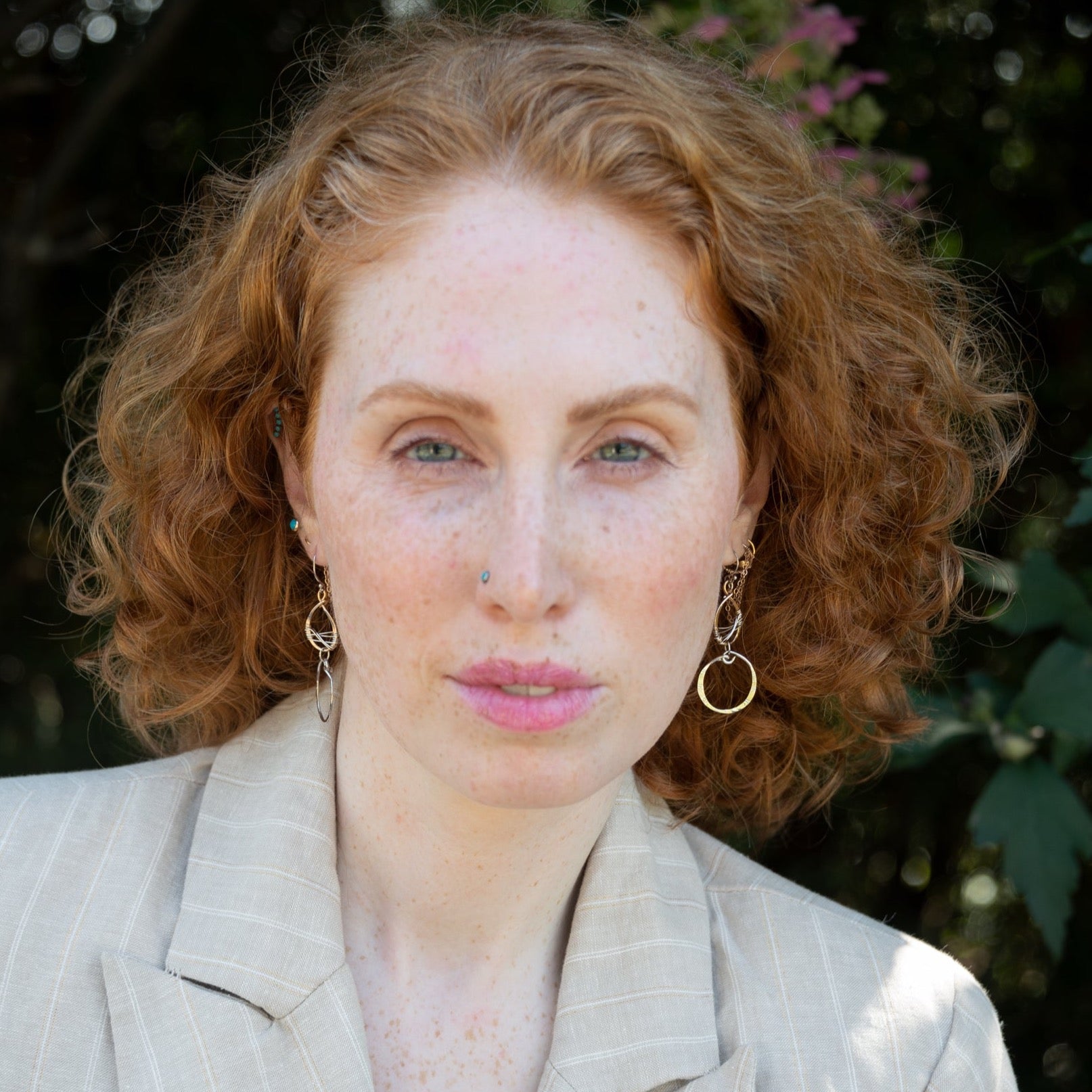 Handmade stamped sterling silver hoops hanging from bronze drops braided with sterling silver fine wire
