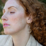 Handmade stamped sterling silver hoops hanging from bronze drops braided with sterling silver fine wire