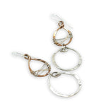 Handmade stamped sterling silver hoops hanging from bronze drops braided with sterling silver fine wire