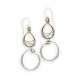 Handmade stamped sterling silver hoops hanging from bronze drops braided with sterling silver fine wire