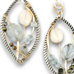 Darkened sterling silver twisted wire marquise shaped earrings embroidered with apatite, opal, aquamarine carved flowers, and crystal gemstones on gold filled wire
