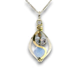 Mini marquise sterling silver pendant necklace with sky blue jade, blue crystal, and aquamarine gemstones held in hammered brass wire on a dainty sterling silver chain