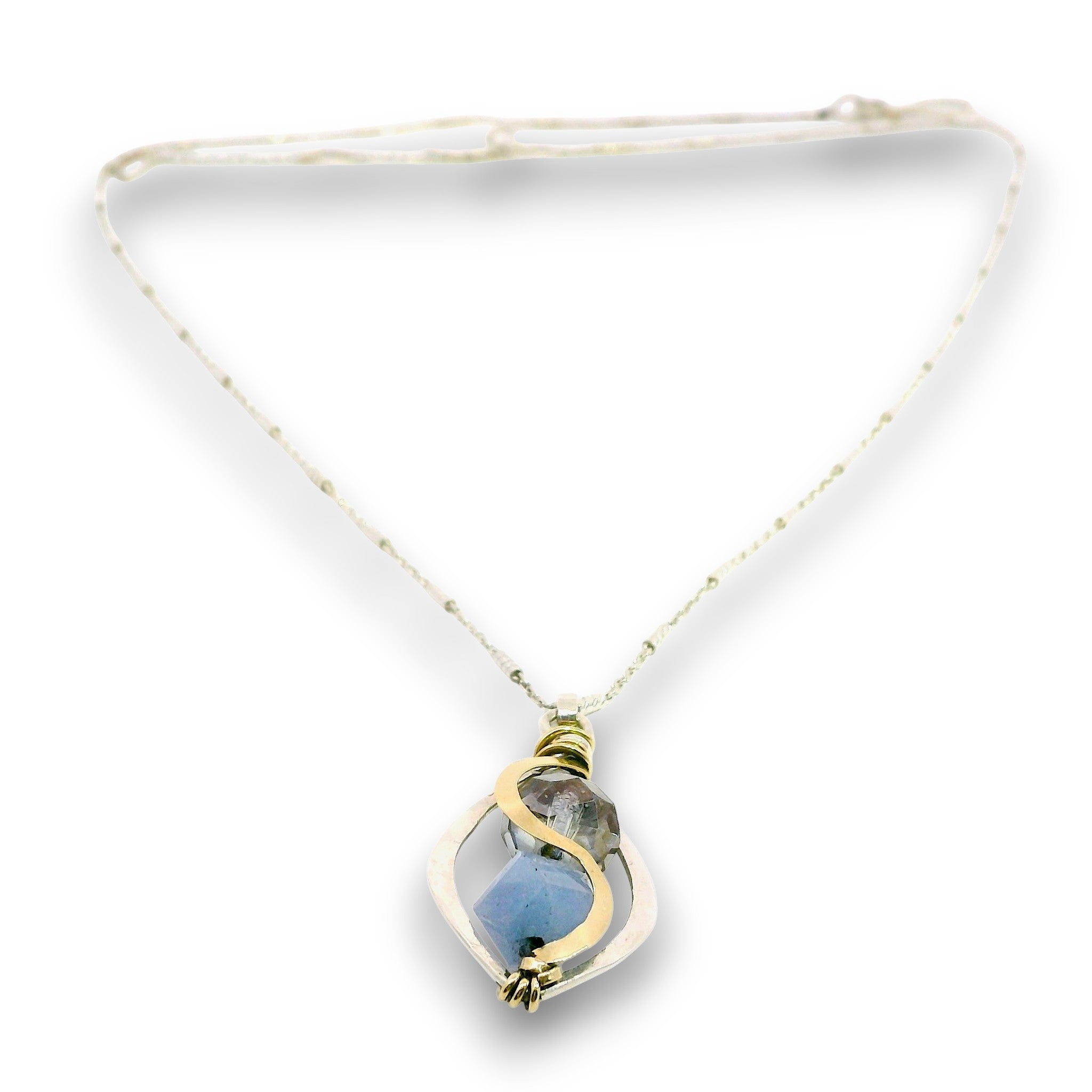 Mini marquise sterling silver pendant necklace with sky blue jade, blue crystal, and aquamarine gemstones held in hammered brass wire on a dainty sterling silver chain
