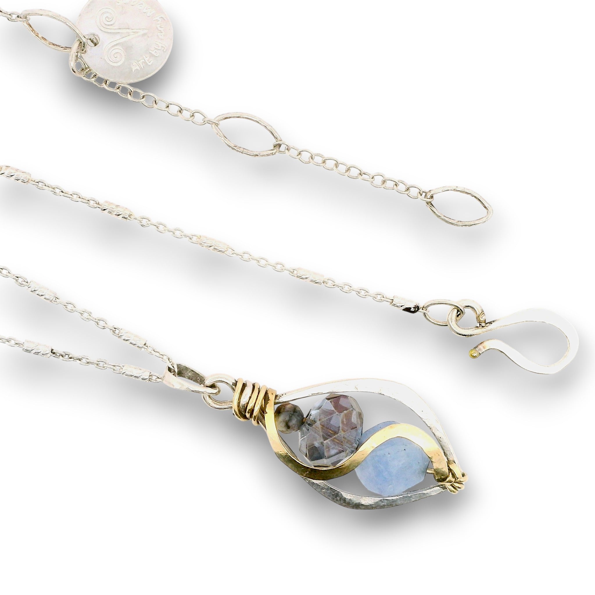 Mini marquise sterling silver pendant necklace with sky blue jade, blue crystal, and aquamarine gemstones held in hammered brass wire on a dainty sterling silver chain