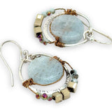 Smooth aquamarine coins are held within sterling silver mini hoops stamped with leaves with crystal accents