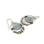 Smooth aquamarine coins are held within sterling silver mini hoops stamped with leaves with crystal accents