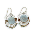 Smooth aquamarine coins are held within sterling silver mini hoops stamped with leaves with crystal accents