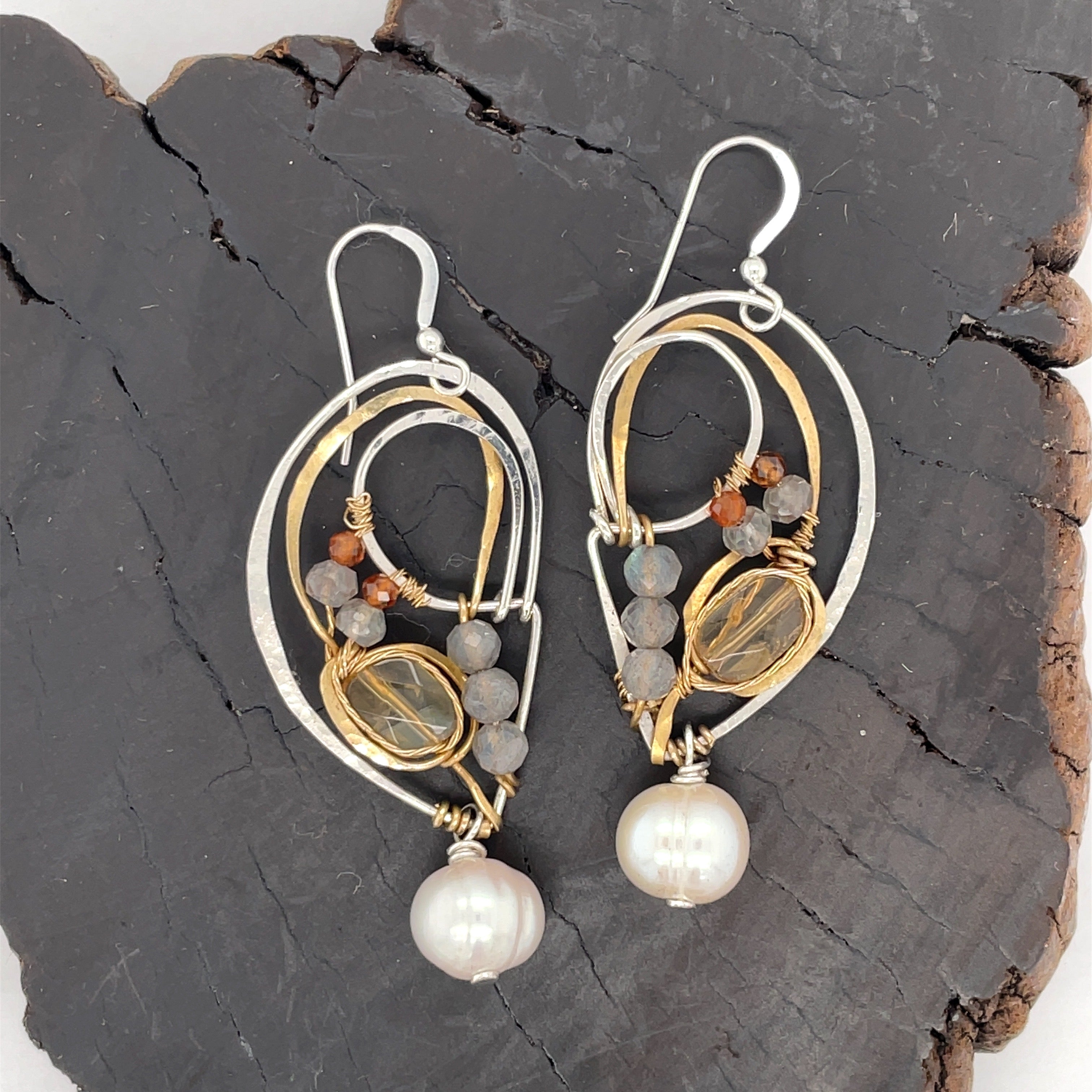 Citrine, labradorite and hessonite garnet gemstones held within sterling silver and brass earrings with a fresh water pearl drop