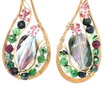 Ruby zoisite and cherry quartz surround layered of gold filled wire and pink crystal inside a bronze drop earring