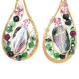 Ruby zoisite and cherry quartz surround layered of gold filled wire and pink crystal inside a bronze drop earring