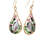 Ruby zoisite and cherry quartz surround layered of gold filled wire and pink crystal inside a bronze drop earring