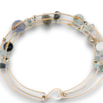 bronze double cuff with sterling silver hammered bars with aquamarine, moonstone, labradorite, apatite, and iolite gemstones