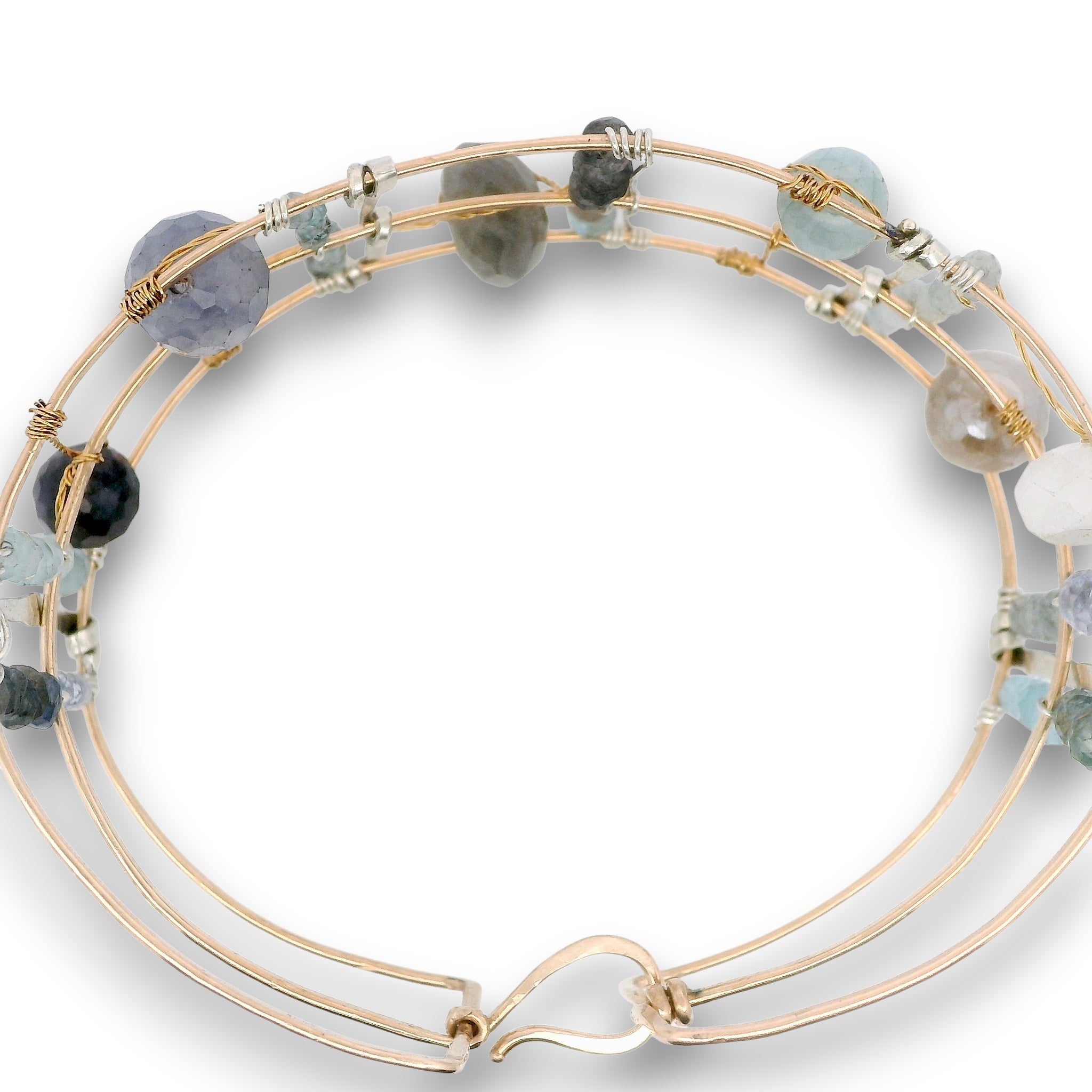 bronze double cuff with sterling silver hammered bars with aquamarine, moonstone, labradorite, apatite, and iolite gemstones