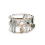 bronze double cuff with sterling silver hammered bars with aquamarine, moonstone, labradorite, apatite, and iolite gemstones