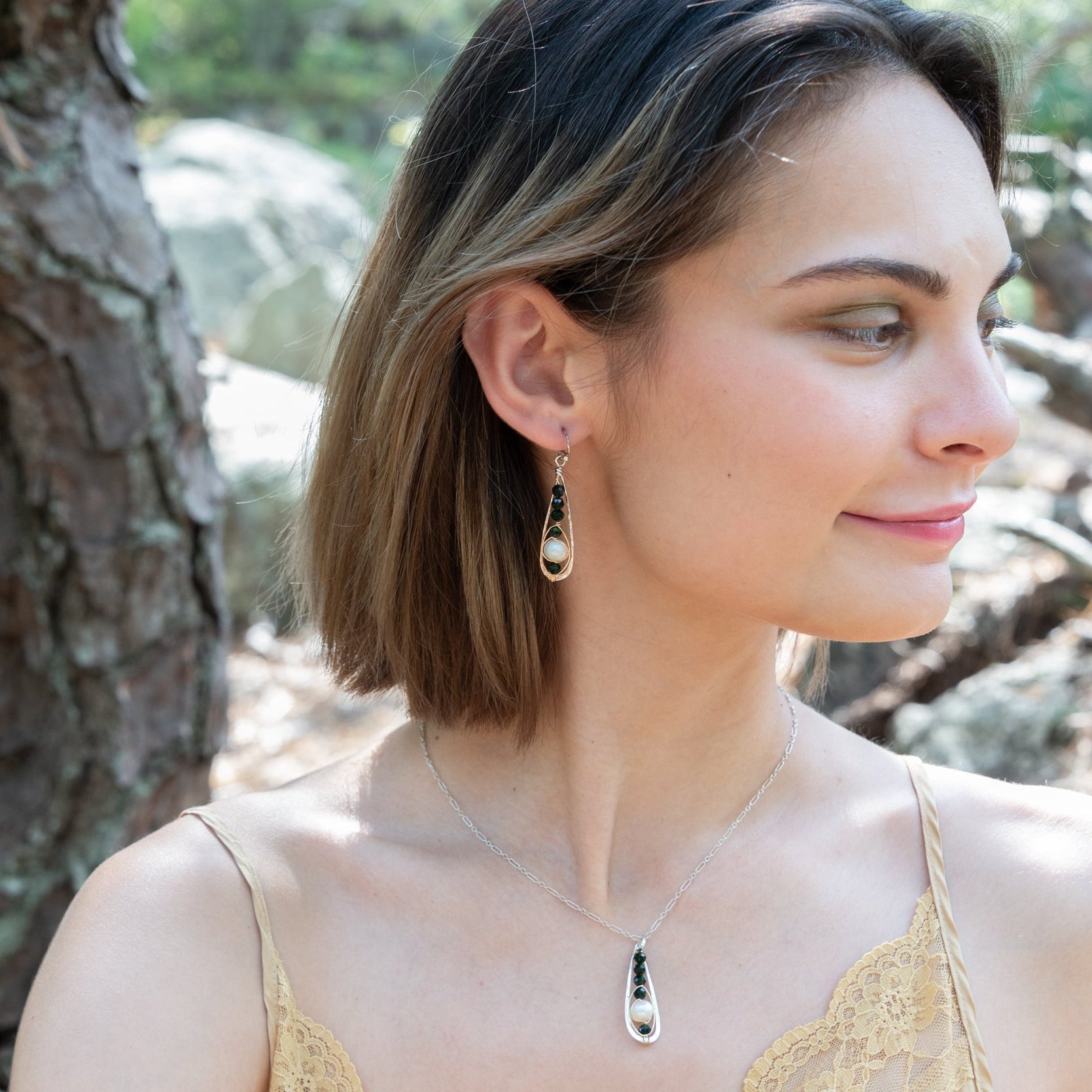 Handmade earrings featuring black-hued pearls, by Art by any Means Jewelry