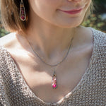 Handmade oxidized sterling silver pendant necklace with a ruby nugget, pink tourmaline and garnet gemstones, by Art by any Means Jewelry