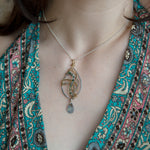 Sterling silver marquise necklace with moss agate and rutilated quartz gemstones in brass and oxidized sterling twist wires