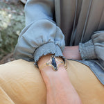 Handmade hammered brass cuff bracelet with a faceted sodalite teardrop and pyrite gemstones, by Art by any Means Jewelry