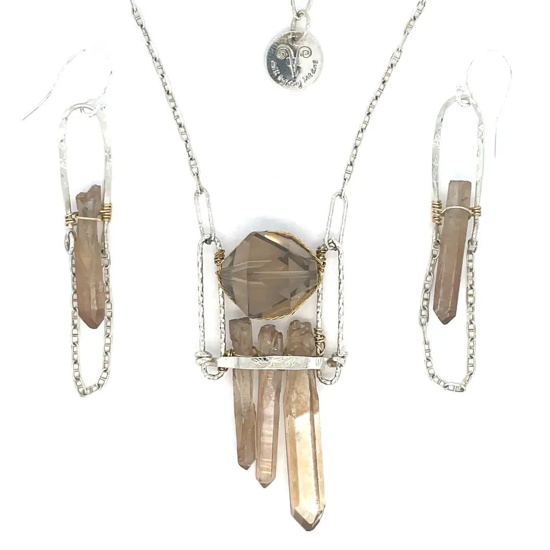 Handformed sterling silver arch with delicate sterling silver chain and natural quartz point detail Art by any Means Jewelry
