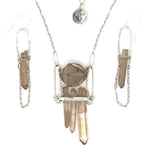 Handformed sterling silver arch with delicate sterling silver chain and natural quartz point detail Art by any Means Jewelry