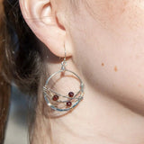 handmade sterling silver hoops with garnet faceted coins, gold-filled wire and darkened sterling silver twisted wire