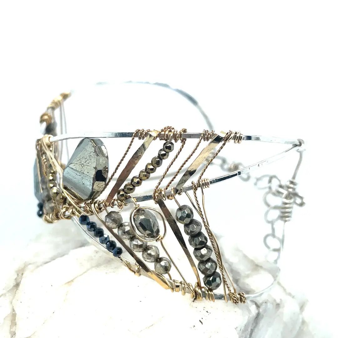 pyrite gemstones embroider a statement sterling silver handmade cuff bracelet, woven with gold filled and brass twist wires