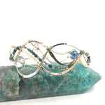 moss agate, green amethyst, crystal, waves of hammered brass, bronze, and sterling silver to form a braided cuff bracelet