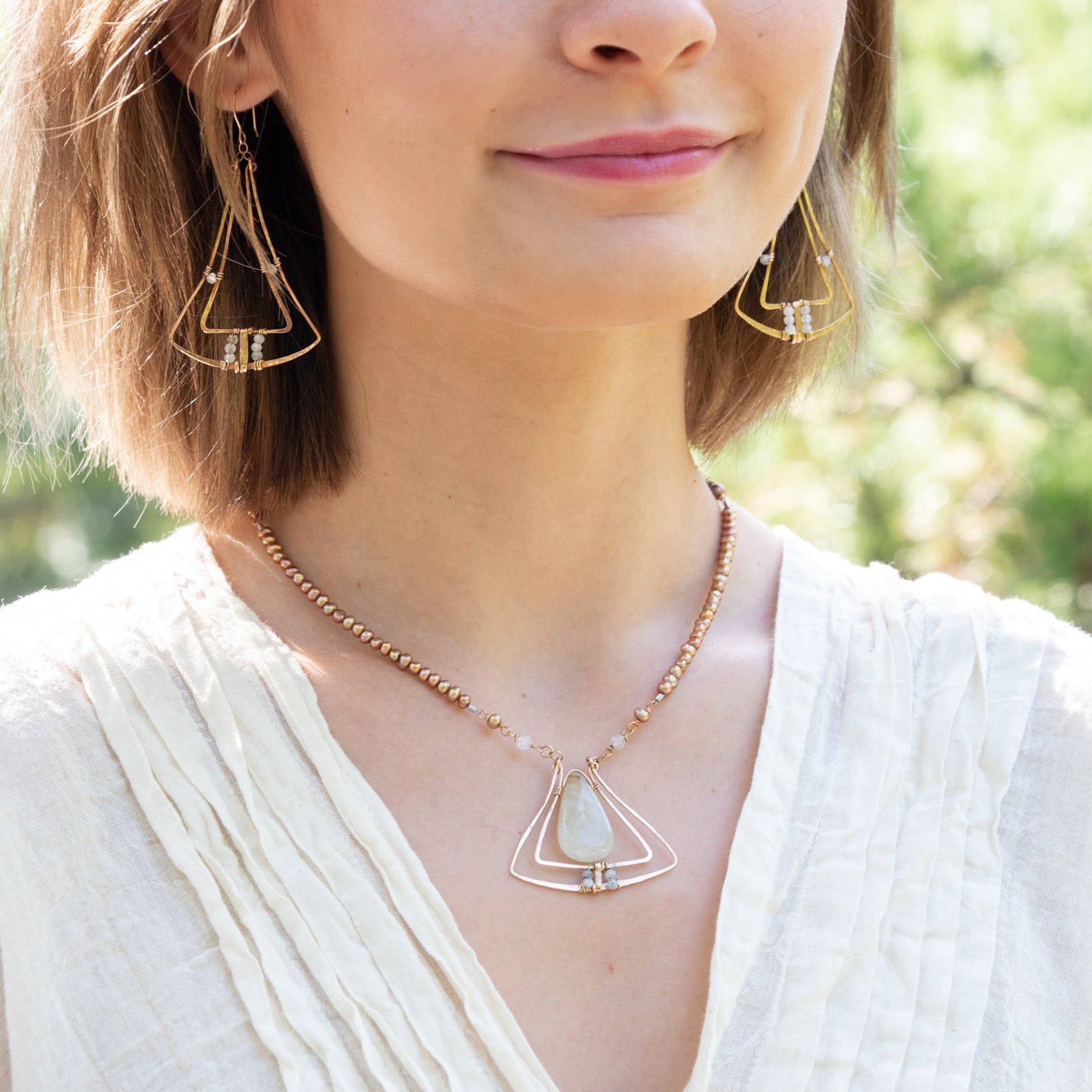 Handmade pendant necklace featuring freshwater pearls, by Art by any Means Jewelry