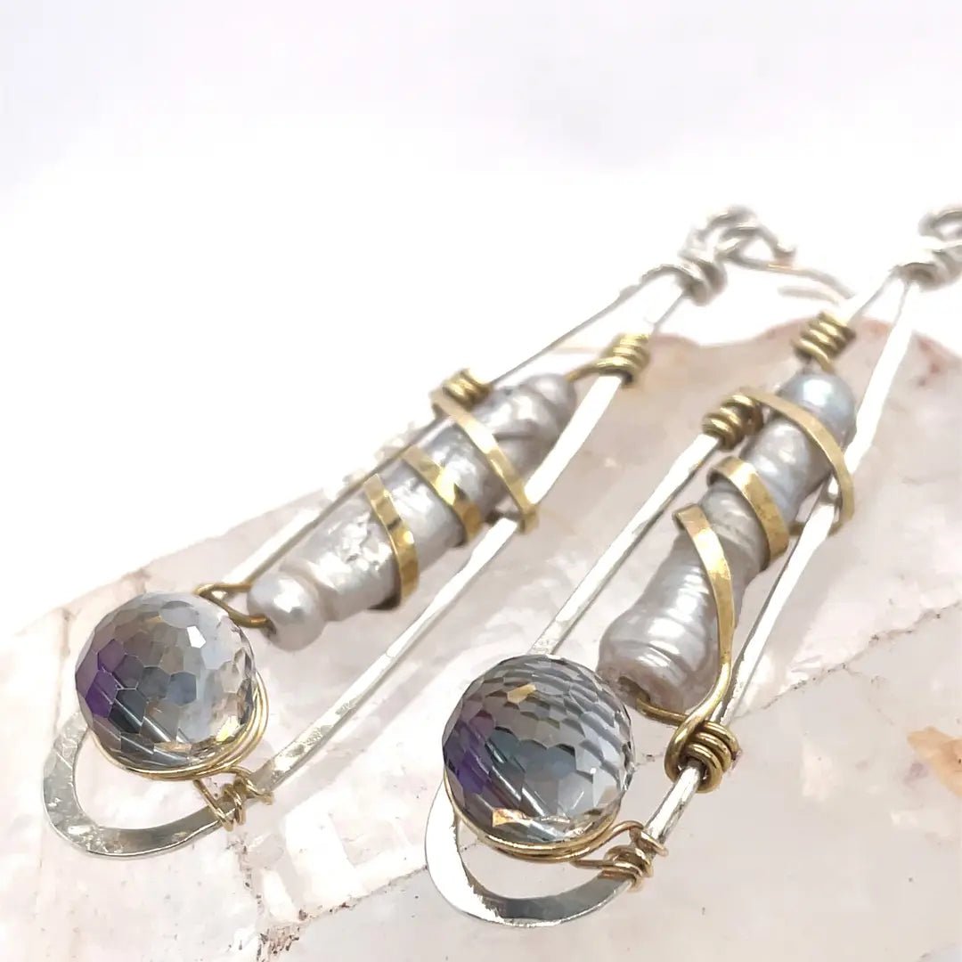 Sterling silver drop earrings with fresh water pearls wrapped in brass wire and crystal disco ball nested in gold filled wire