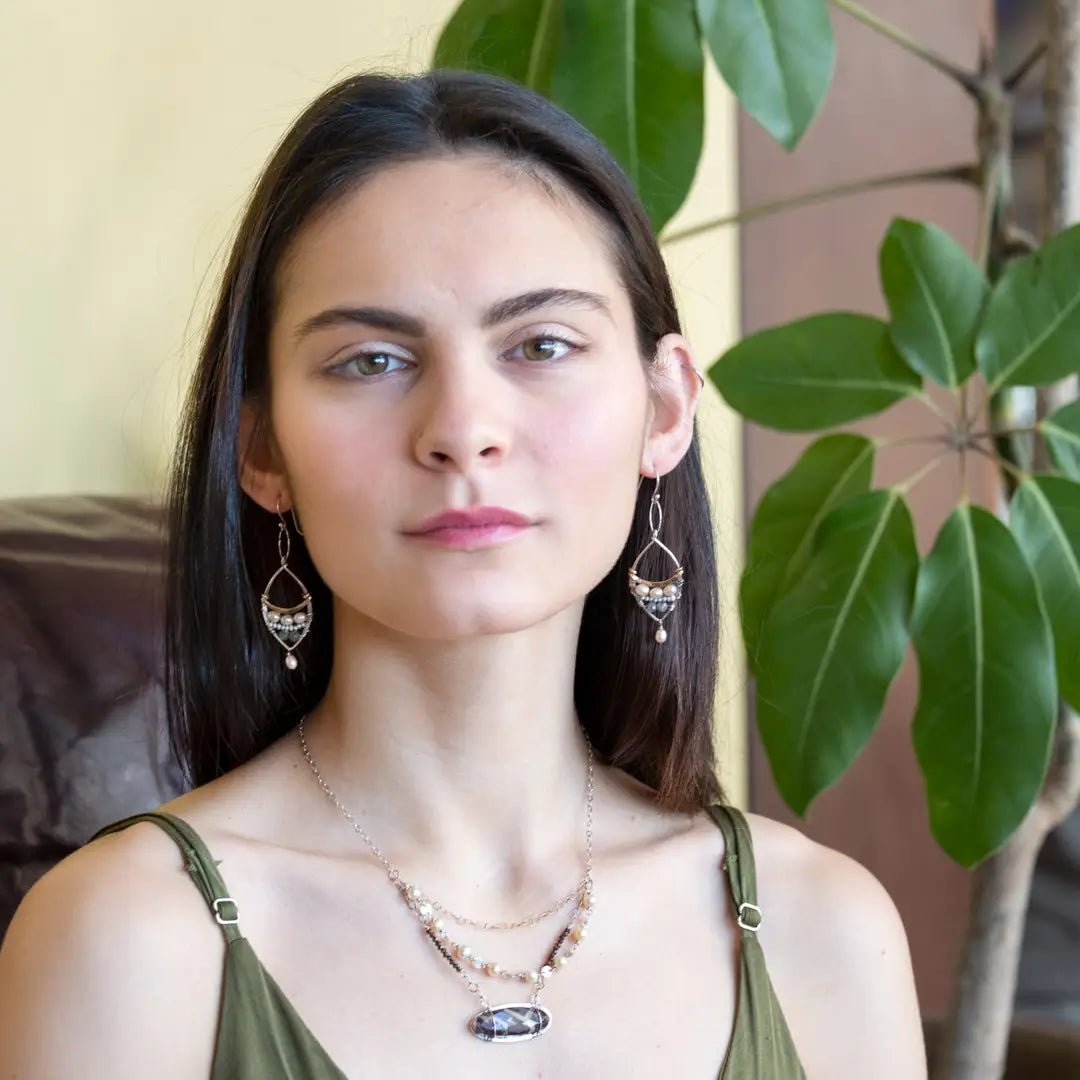 Sterling silver earrings with brass above fresh water pearl and labradorite gemstones with a champagne color pearl danglepearl dangle