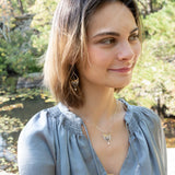Handmade necklace featuring freshwater pearls in a leaf-inspired design, by Art by any Means Jewelry