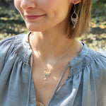 Handmade necklace featuring freshwater pearls in a leaf-inspired design, by Art by any Means Jewelry