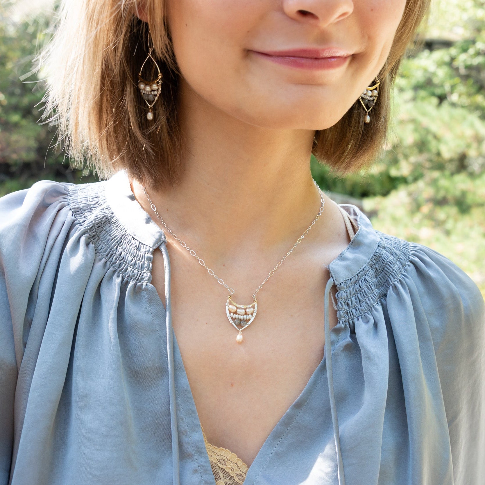 Handmade necklace featuring freshwater pearls in a leaf-inspired design, by Art by any Means Jewelry