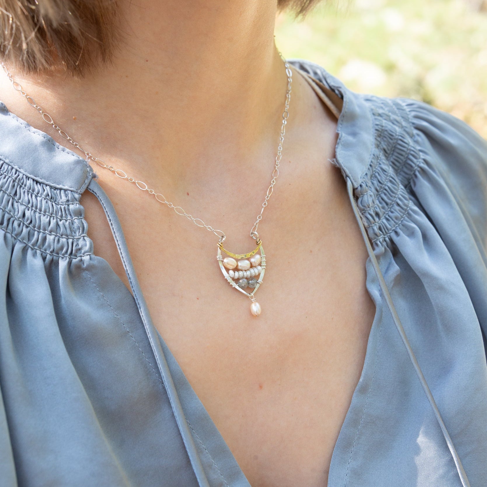 Handmade necklace featuring freshwater pearls in a leaf-inspired design, by Art by any Means Jewelry