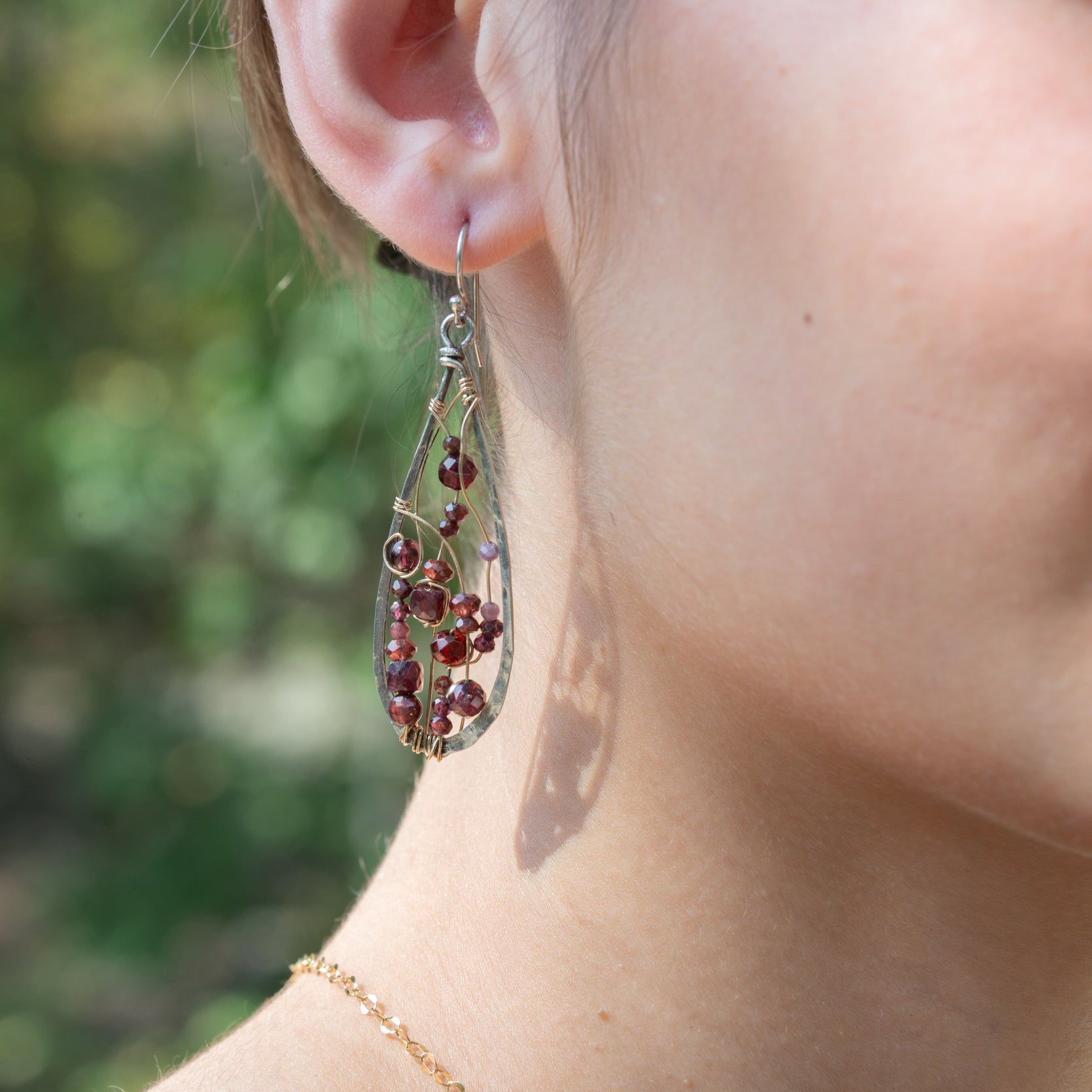 Handmade oxidized sterling silver drop earrings with faceted garnet gemstones, by Art by any Means Jewelry