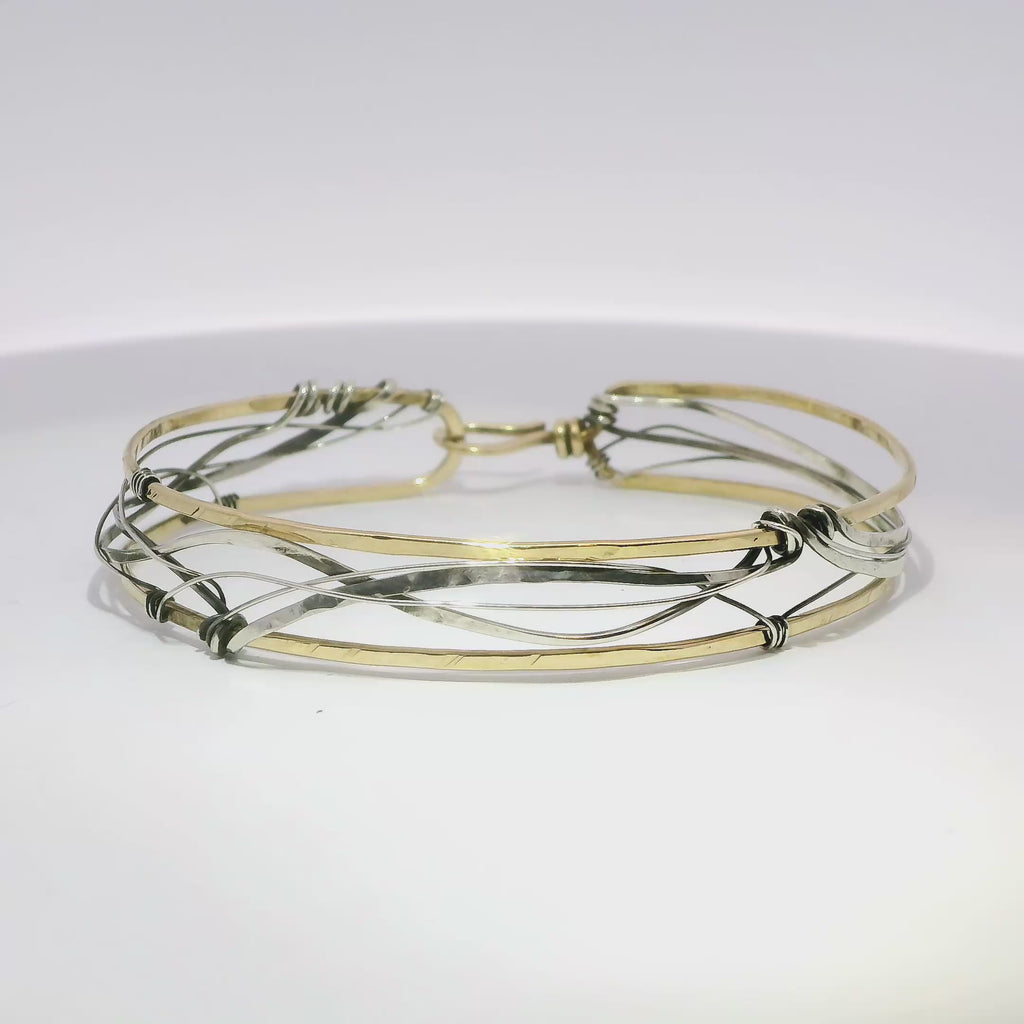 Handmade stamped brass skinny bracelet braided with oxidized sterling silver and gold filled wires