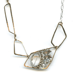 clear quartz oval gemstone with pyrite and crystals on sterling silver wire, bronze parallelogram