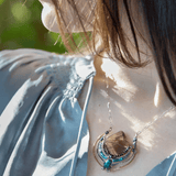 brass pendant necklace, smoky quartz , pyrite, apatite, and chrysocolla, showcased with an oval silver chain and clasp