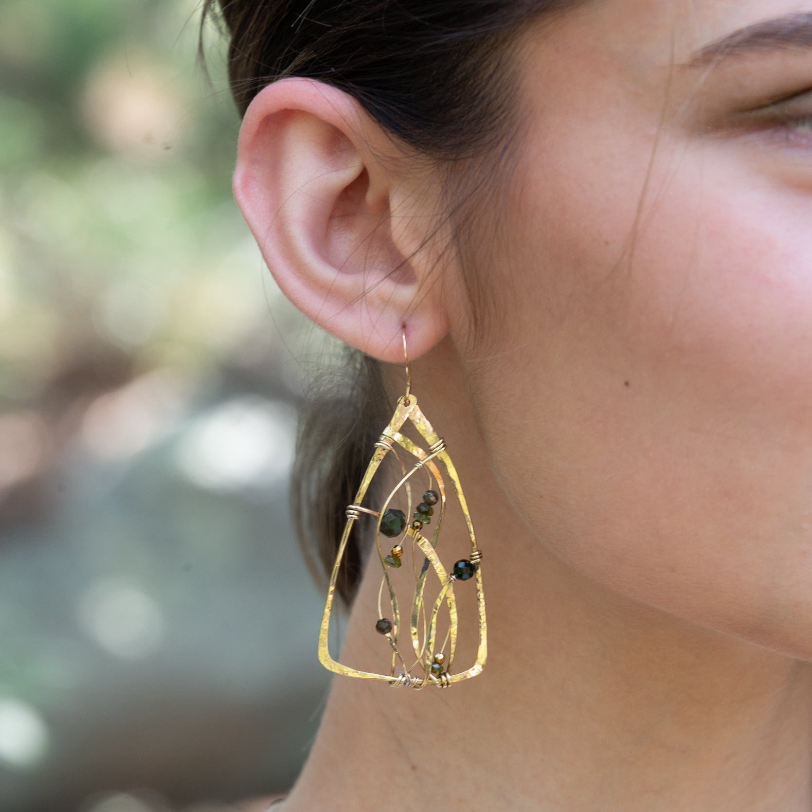Handmade earrings featuring tourmaline gemstones in a garden-inspired design, by Art by any Means Jewelry