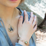 Handmade hammered bronze cuff bracelet with crystal tiles wrapped in sterling silver and brass twist wire, by Art by any Means Jewelry