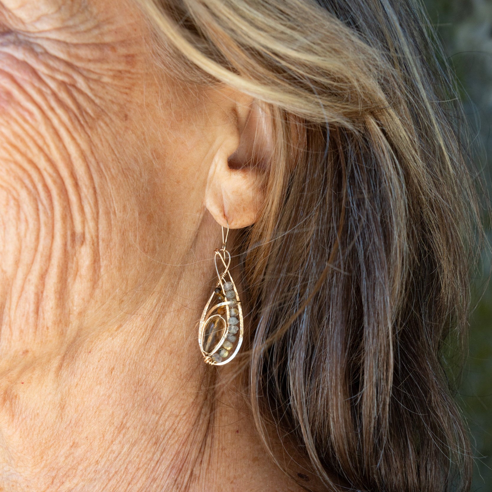 Handmade braided drop earrings featuring whisky-colored quartz gemstones, by Art by any Means Jewelry