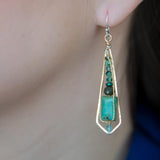 Turquoise smooth rectangles topped with crystal, pyrite, and ruby zoisite gemstones in a long bronze diamond earrings with brass twist accent