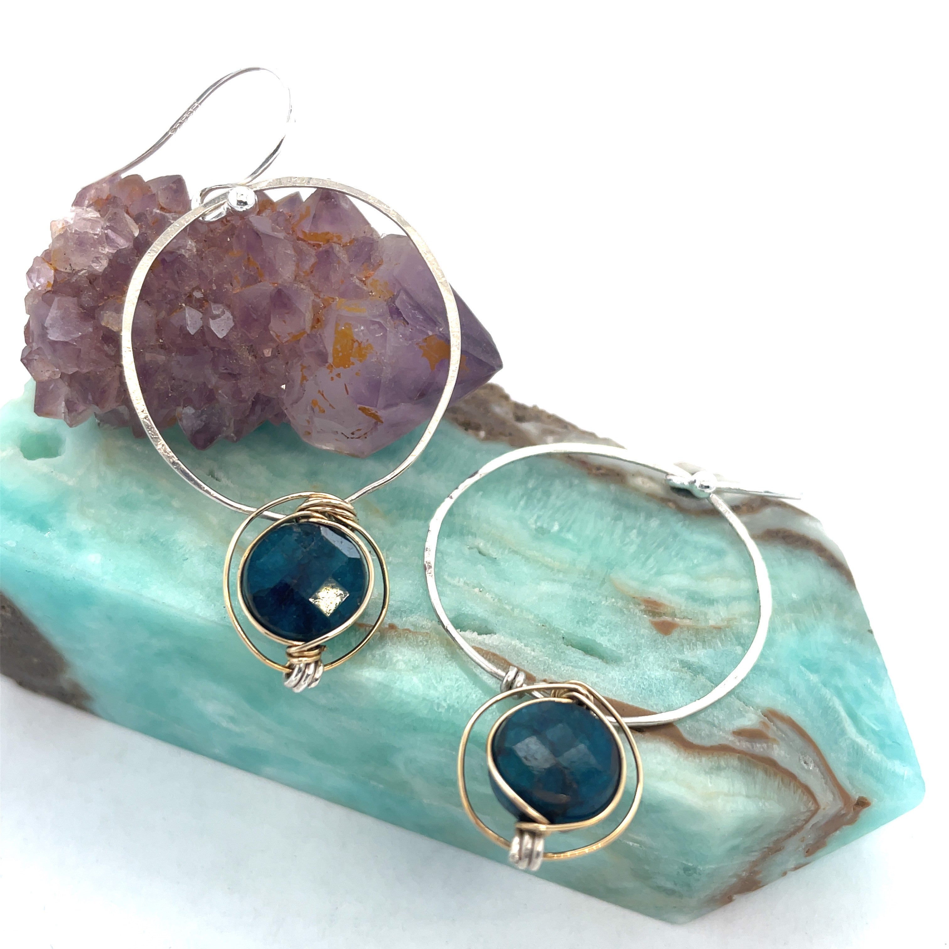 faceted apatite coin gemstone wrapped in gold filled wire held on a sterling silver handmade hoop