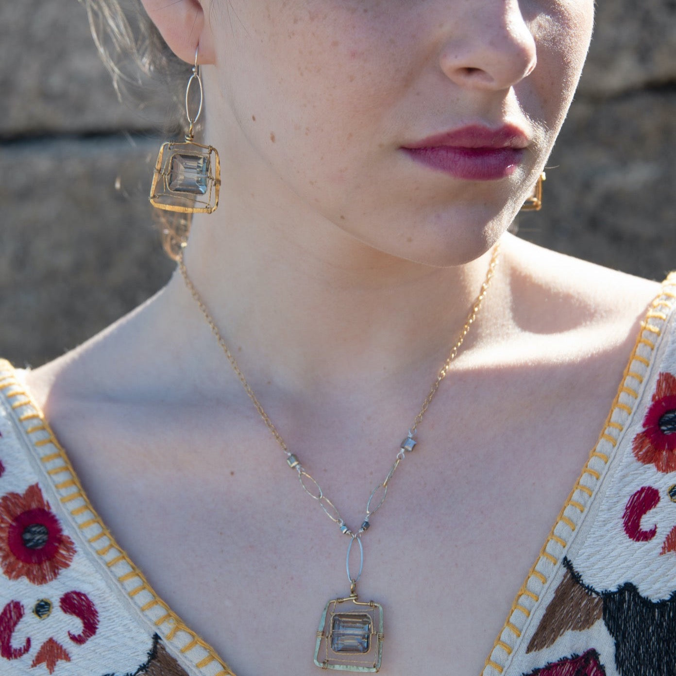 Champagne crystal tile set in twisted brass wire inside a brass box pendant on sterling silver and gold fill textured link and chain necklace