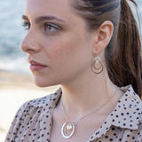 Handmade brass double hoop hanging from moonstone gems and fresh water pearls on gold fill wire