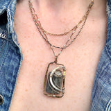 Flashy labradorite smooth rectangle gemstone held in a brass hammered handmade box pendant accented with sterling silver and a faceted green amethyst cube. Necklace features a triple chain, sterling silver and gold filled chains